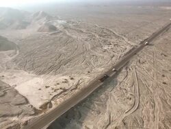 WS AERIAL TS View over vehicles running on road near Nazca lines / South Of Peru, Nazca, Peru Stock Footage