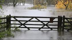 Flood water on the river Rothay during torrential rain in Ambleside, Lake District, Cumbria, UK. Stock Footage