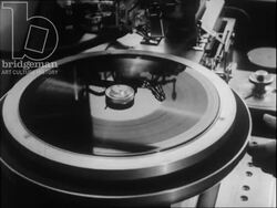 Manufacturing of vinyl discs in factory. Filmed in 1958. Stock Footage
