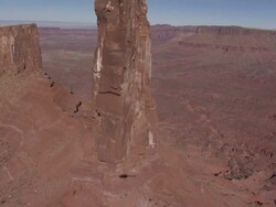 High Angle aerial - Buttes rise above the valley floor in Monument Valley / Arizona, USA Stock Footage