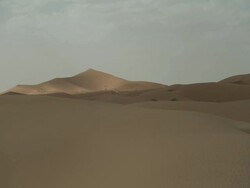 Cloud and sunlight passes over amazing desert dunes. Stock Footage