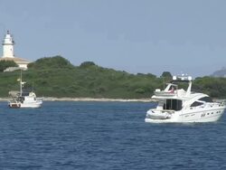 MS Alcanada lighthouse near alcandia  / Cala San Vicente, Mallorco Baleric Island, Spain Stock Footage