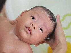 Baby taking a bath Stock Footage