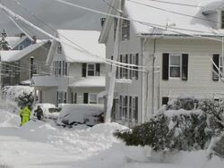 Residents digging out after after big snowstorm - pan Stock Footage