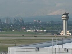 Air Traffic Control Tower Seq mountains and cityscape in bg Stock Footage