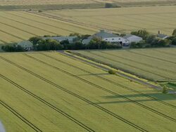 AERIAL WS View of house on grass field / Langeness, Schleswig-Holstein, Germany Stock Footage