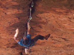 MS ZO Shot of male climber climbing crack upside down / Moab, Utah, United States Stock Footage