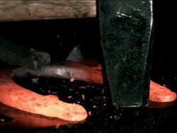 CU hammer hitting red hot horseshoe, high speed Stock Footage