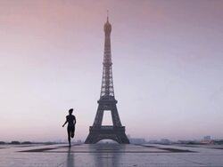 woman running towards the Eiffel tower Stock Footage