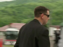 MS PAN Shot of television news crews working outside during G8 meeting / Hokkaido Toyako, Japan Stock Footage
