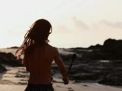 MS Rasta man spinnin poi balls on beach and walking towards / Montezuma, Punteranes, Costa Rica Stock Footage