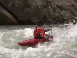 Medium hand-held zoom-in zoom-out - A kayaker paddles through furious rapids in the Grand Canyon / USA Stock Footage