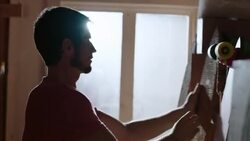 Shop worker ties price tags to specialty longboards in Wood Studio Stock Footage