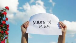 Holding Paper Sign of English Words Made in USA in the Sky Stock Footage
