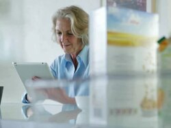 Senior tablet breakfast    CM LI Stock Footage