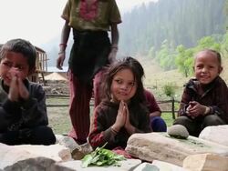 MS kids praying at Himalayan Mountains / Durma, Banke District, Nepal Stock Footage