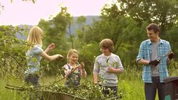 LS PAN Family Grinding Branches Stock Footage