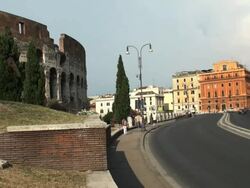 Road next to the Colosseum, Rome; tourists and traffic, timelapse Stock Footage