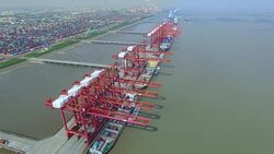 Aerial view of commercial dock with cargo containers in shanghai. Stock Footage