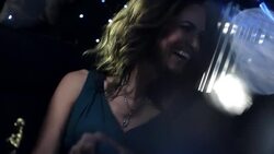 Celebrity couple laugh in limousine and wave to paparazzi at awards show Stock Footage