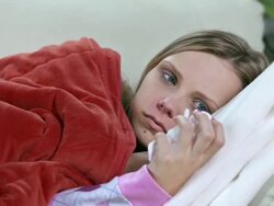 HD DOLLY: Woman With Cold Lying On Sofa Stock Footage