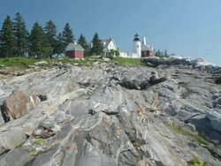 T/L people moving around on rocks, Pemiquid Lighthouse, Maine Stock Footage