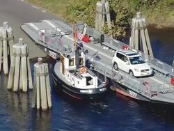  MS AERIAL ZI TS Small boat pulling Glastonbury Ferry boat / Connecticut, United States Stock Footage