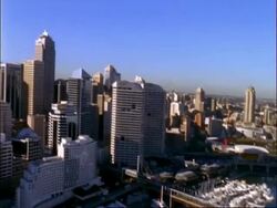 Aerial view of Sydney skyline, pan left over harbour, Sydney, Australia Stock Footage