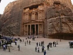 T/L, WS, fish eye, fast moving people outside the Al Khazneh (Treasury) at ancient stone city of Petra / Jordan Stock Footage