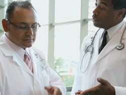 CU Two physicians looking over some paperwork and talking  / Seattle, Washington, USA Stock Footage