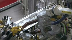 Robots assemble parts in an automotive factory. Stock Footage