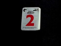 T/L - Pages being ripped off a desk calendar, black background Stock Footage