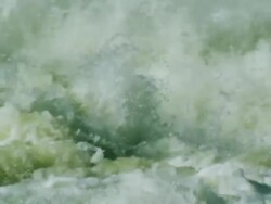 Slow motion dramatic water churning behind dam Stock Footage