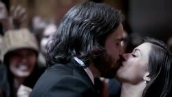 Glamorous couple share a kiss on red carpet for fans and photographers at awards show Stock Footage