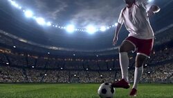 Soccer player dribbling a ball on the field Stock Footage