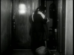 A soldier greets his wife and family outside of their apartment as he returns from World War II. News Clip