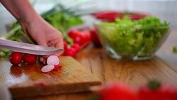 Cutting of garden radish for salad Stock Footage