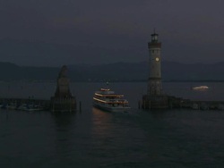 WS View of Lindau harbour entrance and lighthouse at night on Lake Constance / Lindau, Bavaria, Germany  Stock Footage