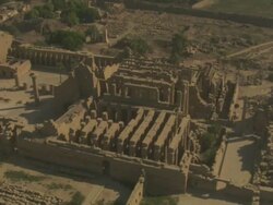 High Angle, aerial zoom-out - Sandstone historical ruins with large pillars stand out in the Egyptian Nile Delta Stock Footage