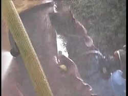 CU Fire fighter scrubbing mask of chemical suit Stock Footage