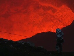Scientist observes erupting lava lake, Marum Volcano, Ambrym Island, Vanuatu Stock Footage