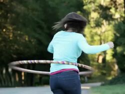 MS TU Young woman hula hooping on country street / Richmond, Virginia, United States Stock Footage