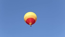 Colorful hot air balloon on blue sky Stock Footage
