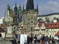 MS People walking on charles bridge and artist sitting with her painting / Prague, Hlavni mesto Praha, Czech Republic  Stock Footage