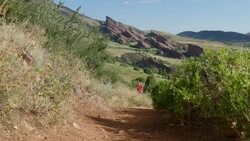 HD video man trail runs Mount Falcon Red Rocks Colorado Stock Footage