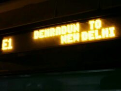 WS Flashing train station sign in English and Hindi / India Stock Footage