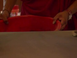 MS ZO TU Monks finishing  pushing sand from mandala into bucket  / Kathmandu, Central, Nepal Stock Footage