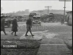 1918: WWI FRANCE: WS Army vehicles, cars, trucks moving forward out of parked area. Instructional Video