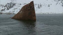A shipwreck protrudes from Alaska's Dutch Harbor. Stock Footage