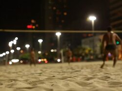 Ipanema Beach, Guys playing beach tennis, Night Stock Footage